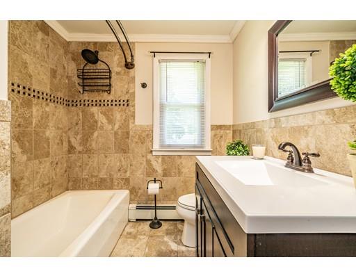 91 Mildred Avenue Springfield, MA 01104 - Photo 26 of 41 a bathroom with a sink a bathtub and a shower