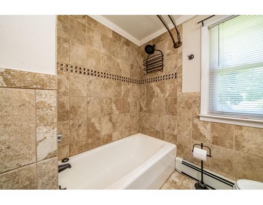 91 Mildred Avenue Springfield, MA 01104 - Photo 27 of 41 a bathroom with a bathtub and shower