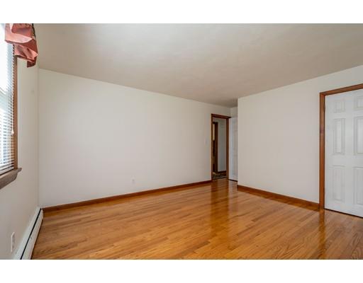 91 Mildred Avenue Springfield, MA 01104 - Photo 30 of 41 a view of an empty room and wooden floor