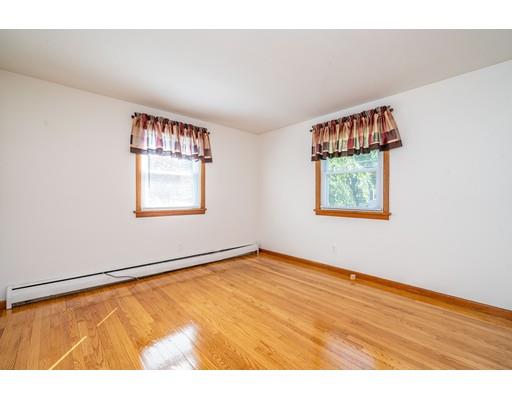 91 Mildred Avenue Springfield, MA 01104 - Photo 31 of 41 a view of an empty room with window and wooden floor