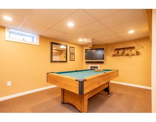 91 Mildred Avenue Springfield, MA 01104 - Photo 38 of 41 a living room with a flat screen tv and furniture