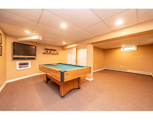 91 Mildred Avenue Springfield, MA 01104 - Photo 40 of 41 a spacious bedroom with a bed and a flat screen tv