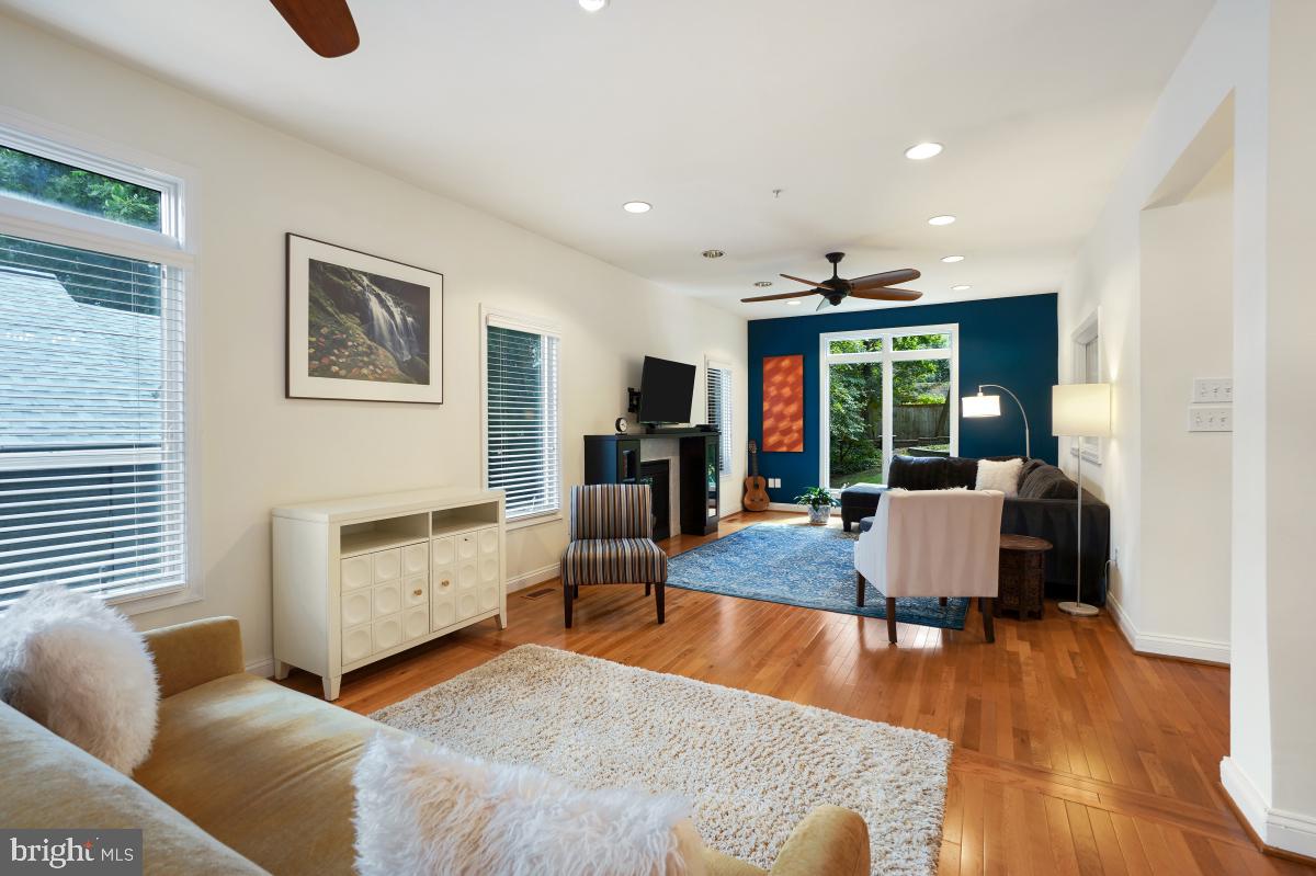 412 Silver Spring Avenue Silver Spring, MD 20910 - Photo 15 of 48 a living room with furniture and a wooden floor