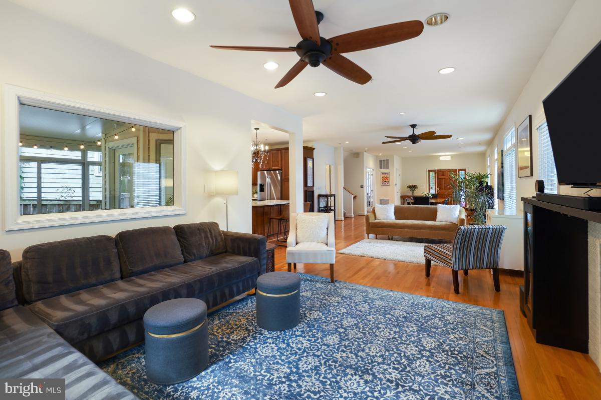 412 Silver Spring Avenue Silver Spring, MD 20910 - Photo 19 of 48 a living room with furniture and a flat screen tv