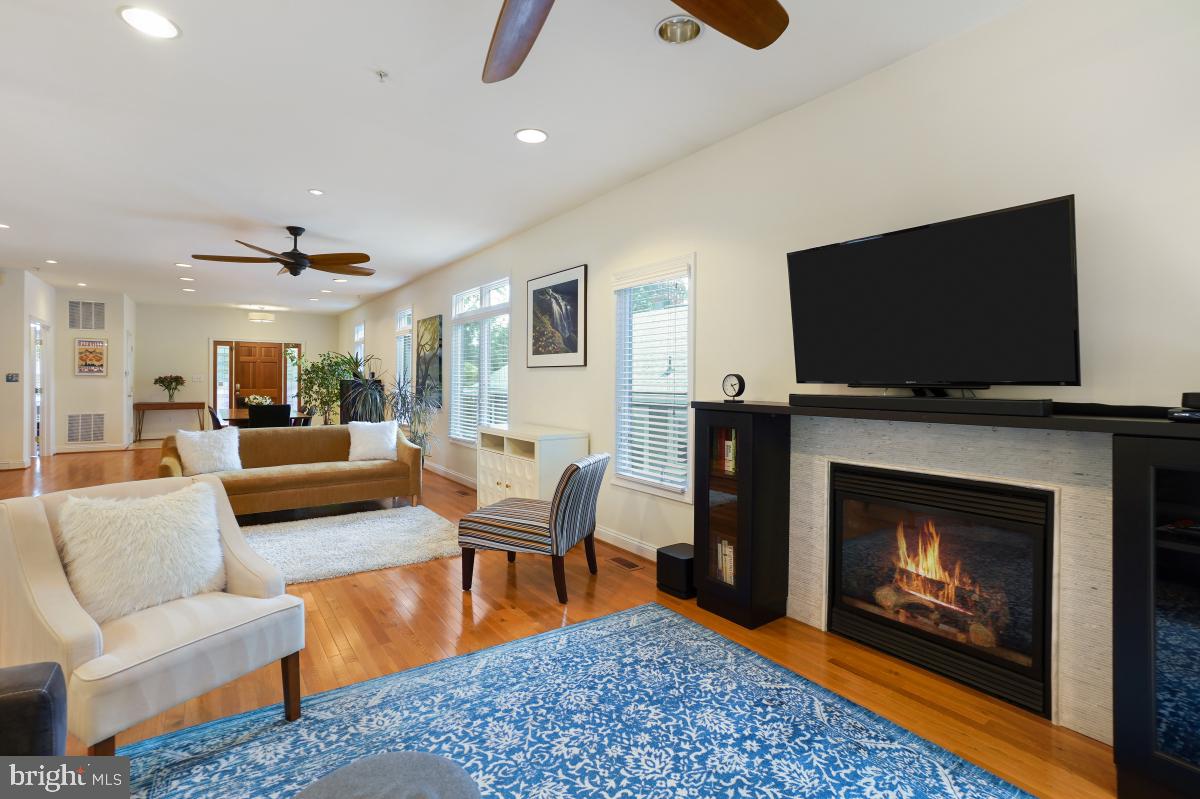 412 Silver Spring Avenue Silver Spring, MD 20910 - Photo 20 of 48 a living room with furniture and a fireplace or television