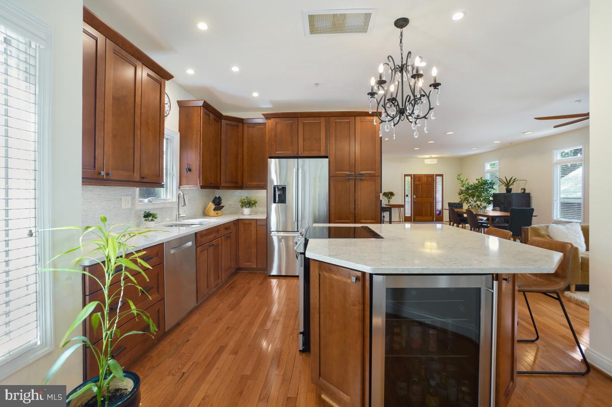 412 Silver Spring Avenue Silver Spring, MD 20910 - Photo 23 of 48 a large kitchen with a table and chairs