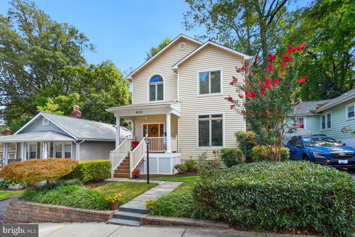 412 Silver Spring Avenue Silver Spring, MD 20910 - Photo 3 of 48 a front view of a house with a yard and potted plants