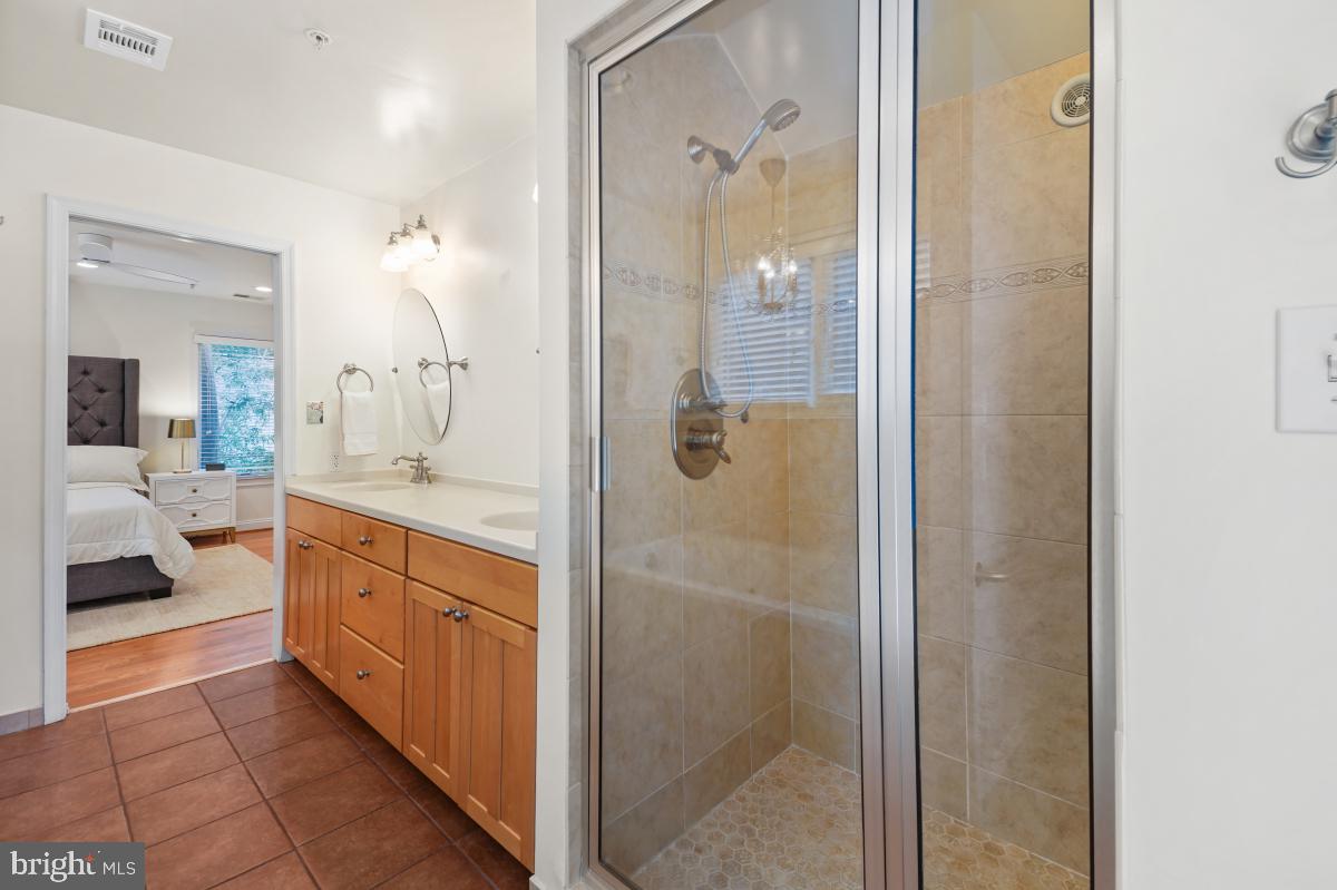 412 Silver Spring Avenue Silver Spring, MD 20910 - Photo 36 of 48 a spacious bathroom with a shower and a sink