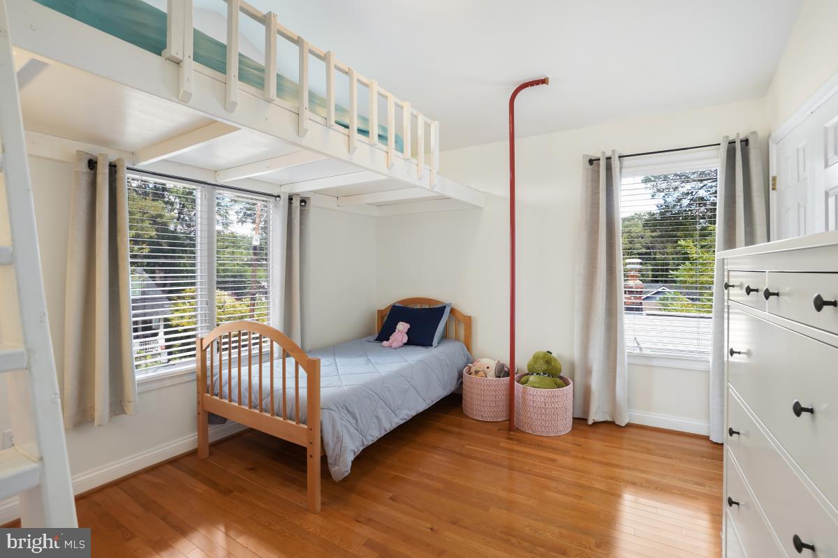 412 Silver Spring Avenue Silver Spring, MD 20910 - Photo 38 of 48 a living room with a bed furniture and a window
