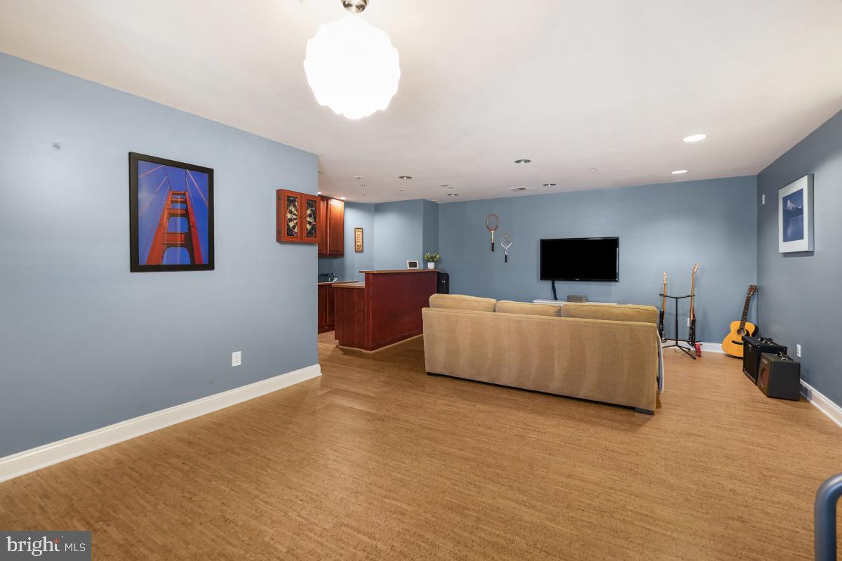 412 Silver Spring Avenue Silver Spring, MD 20910 - Photo 41 of 48 a living room with furniture and a flat screen tv