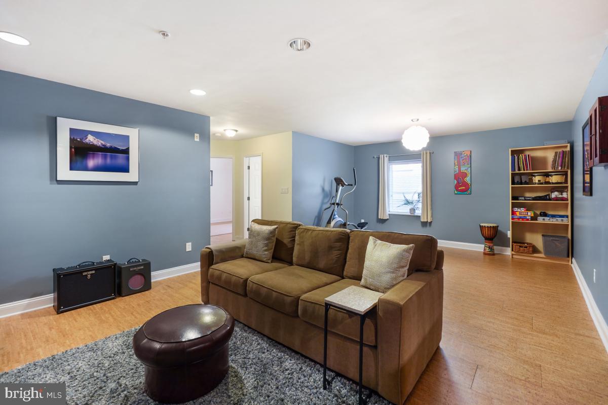 412 Silver Spring Avenue Silver Spring, MD 20910 - Photo 42 of 48 a living room with furniture and a wooden floor