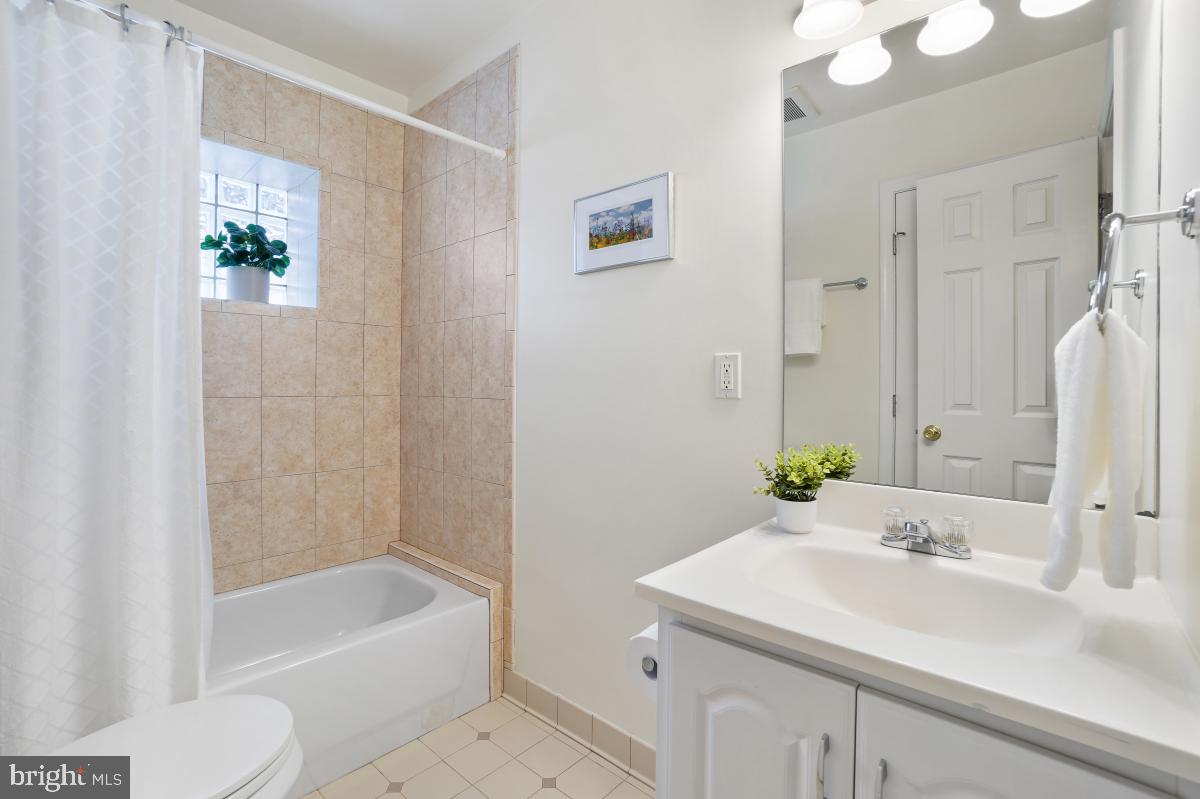 412 Silver Spring Avenue Silver Spring, MD 20910 - Photo 45 of 48 a bathroom with a sink and a bathtub