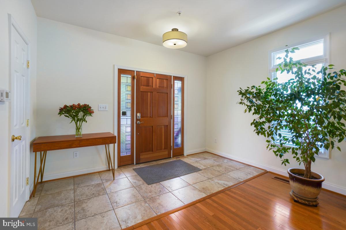412 Silver Spring Avenue Silver Spring, MD 20910 - Photo 7 of 48 a living room with furniture and a potted plant