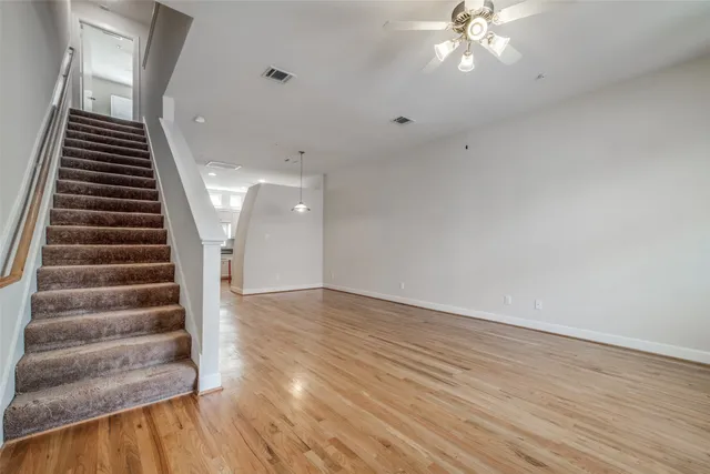 wooden floor in an empty room with a mirror