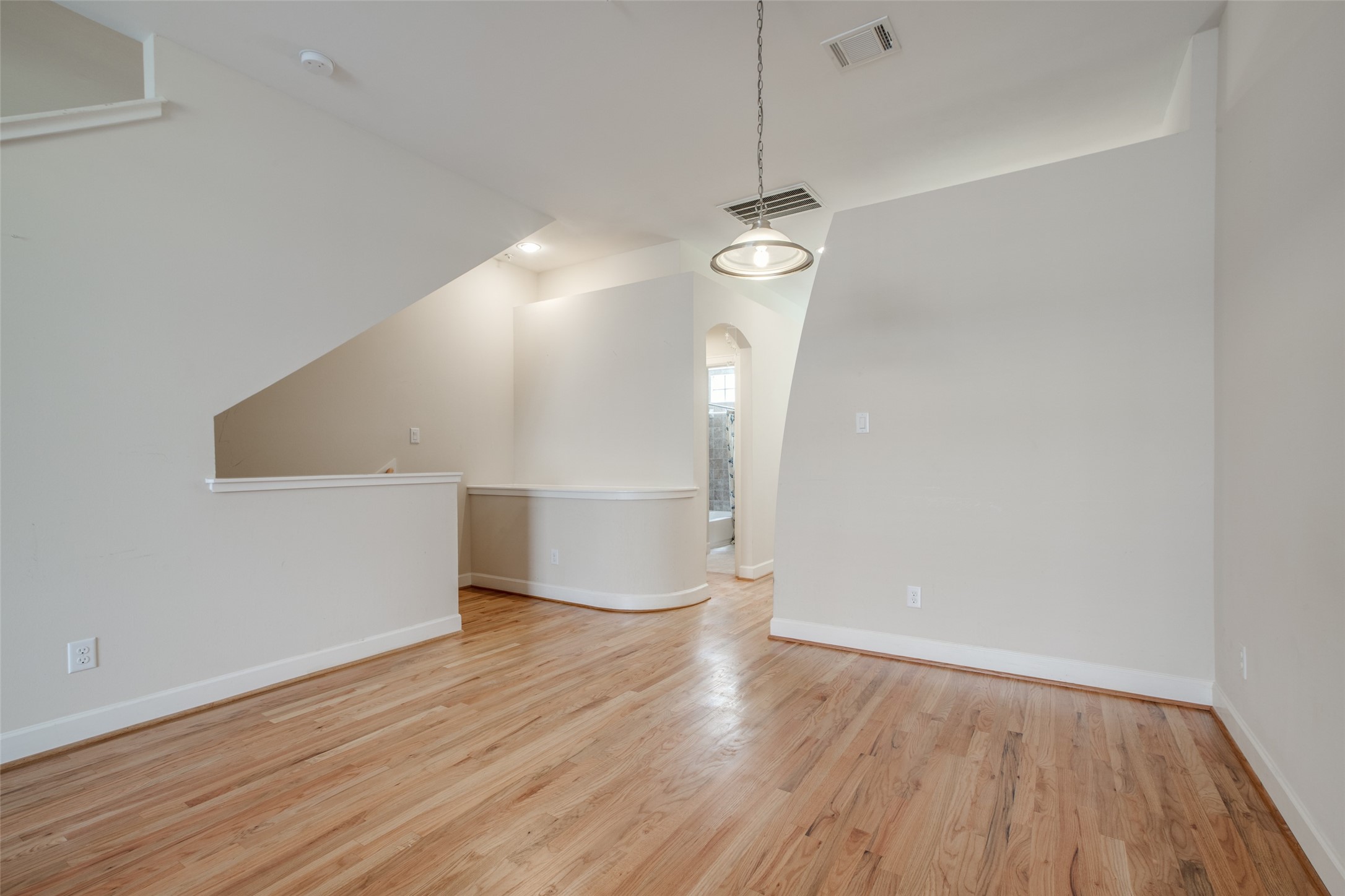 2710 Hullsmith Drive, Unit 401 Houston, TX 77063 - Photo 4 of 25 a view of empty room with wooden floor