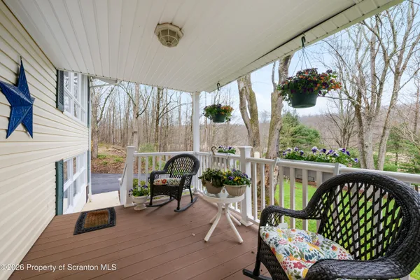 a view of a porch with furniture