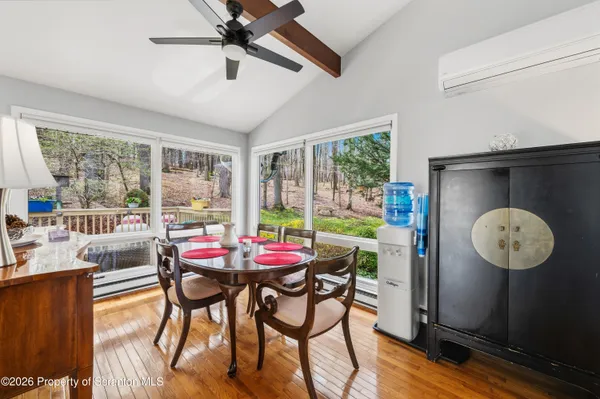 a view of a dining room with furniture window and outside view