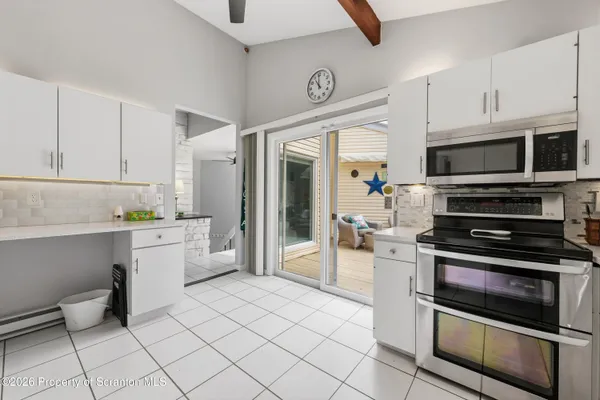 a kitchen with a stove and a microwave