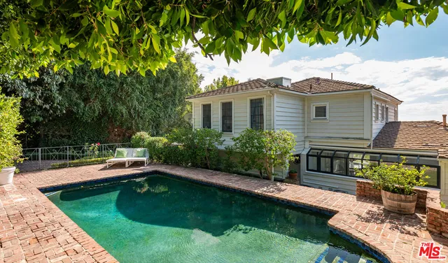 a house view with a garden space