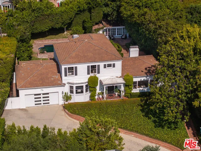 an aerial view of a house with garden