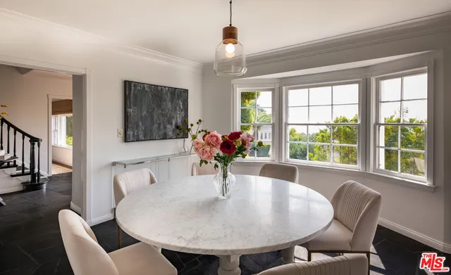 a view of a dining room with furniture window and outside view