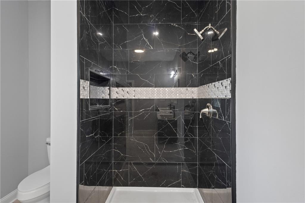 1275 Riverside Road Sugar Hill, GA 30518 - Photo 12 of 17 a bathroom with a shower
