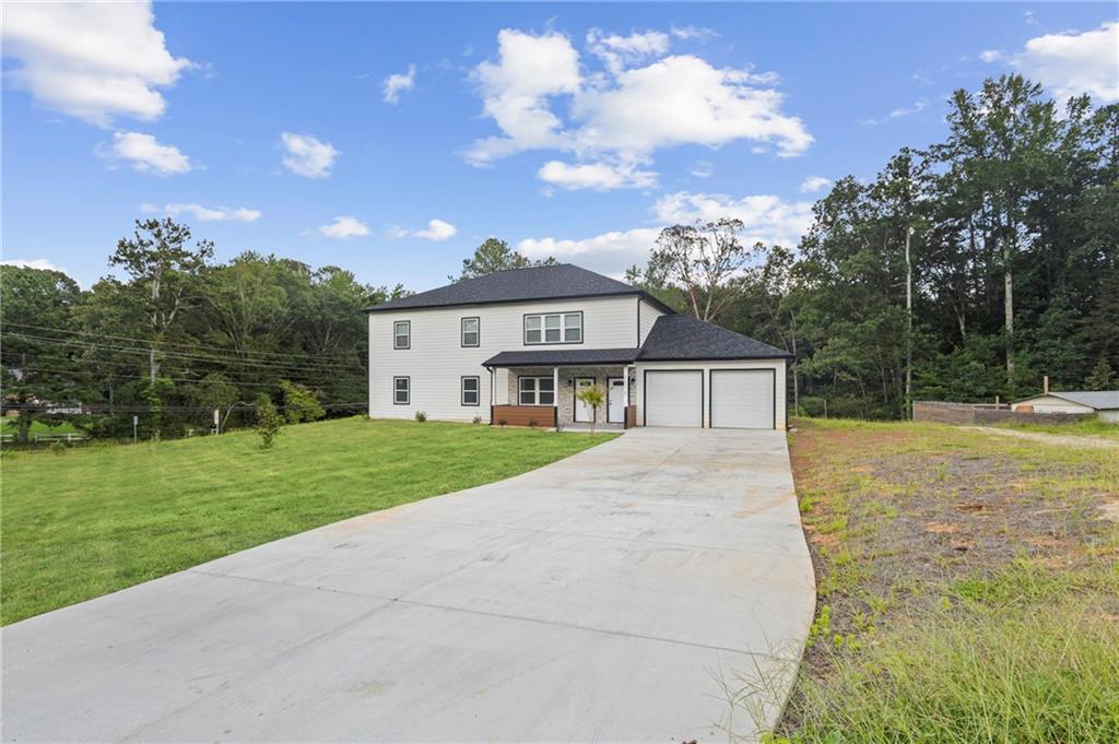1275 Riverside Road Sugar Hill, GA 30518 - Photo 6 of 17 a view of house with a big yard