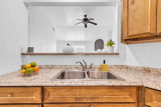a kitchen with a sink and cabinets