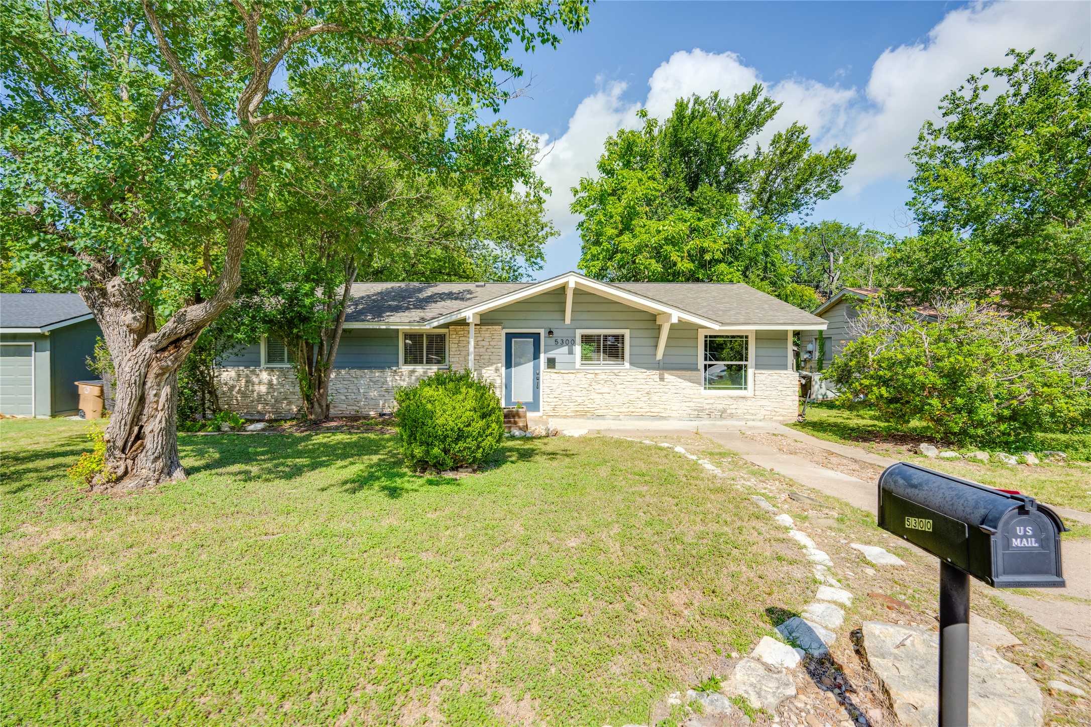 5300 Halmark Drive Austin, TX 78723 - Photo 1 of 40 A charming exterior with a blend of siding and stone accents awaits new residents.