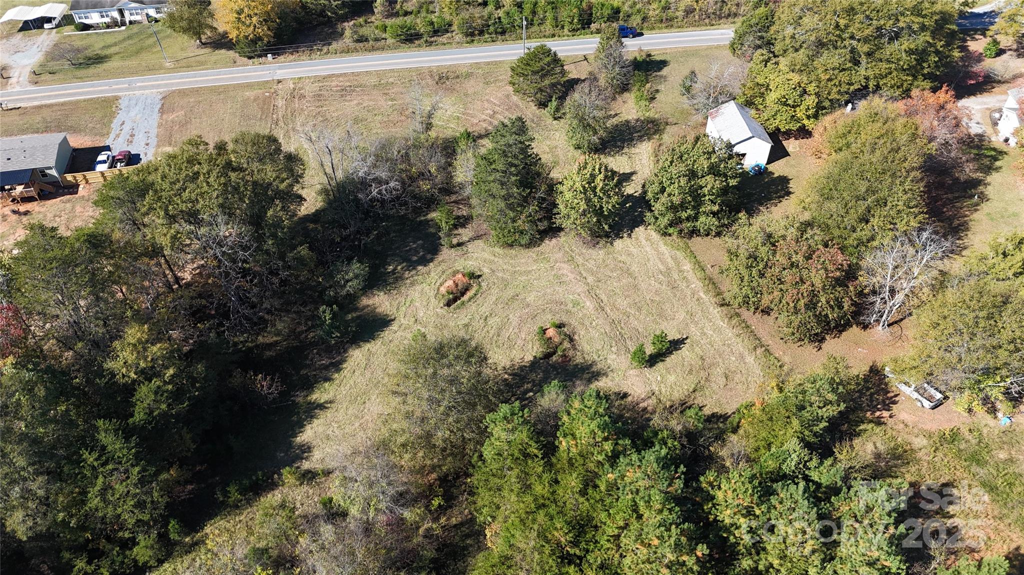 0 Grover Scruggs Road Mooresboro, NC 28114 - Photo 3 of 13 an aerial view of a house with a yard and large trees
