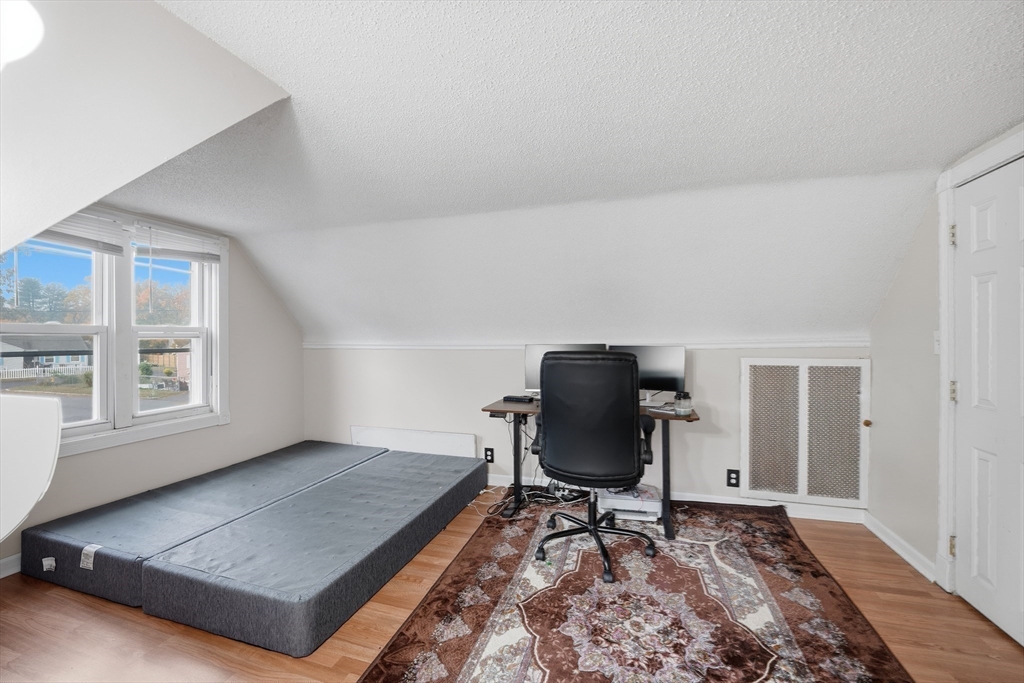 63 Peer Street Springfield, MA 01109 - Photo 20 of 41 a living room with furniture rug and window