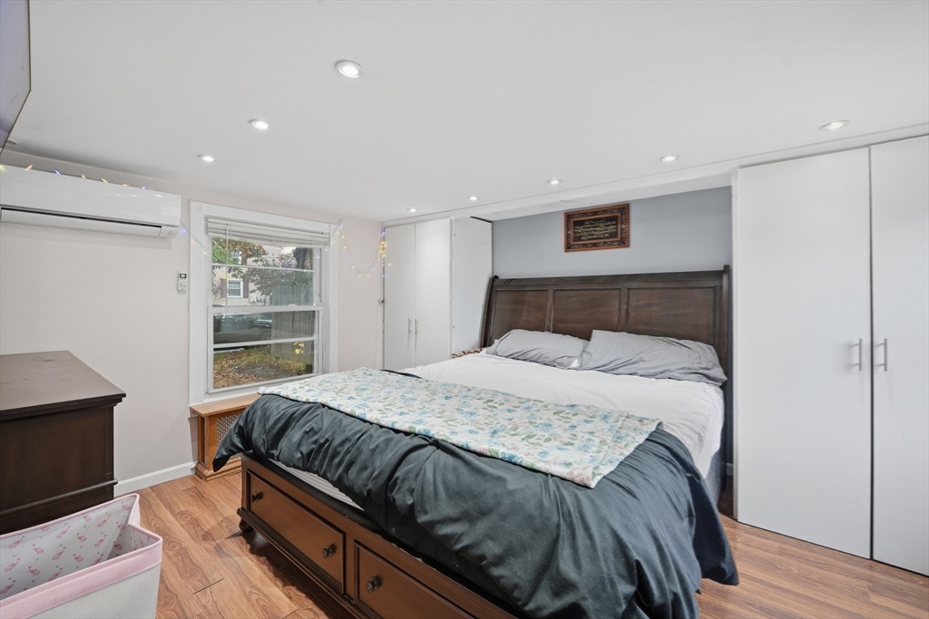 63 Peer Street Springfield, MA 01109 - Photo 26 of 41 a bedroom with a bed and a window