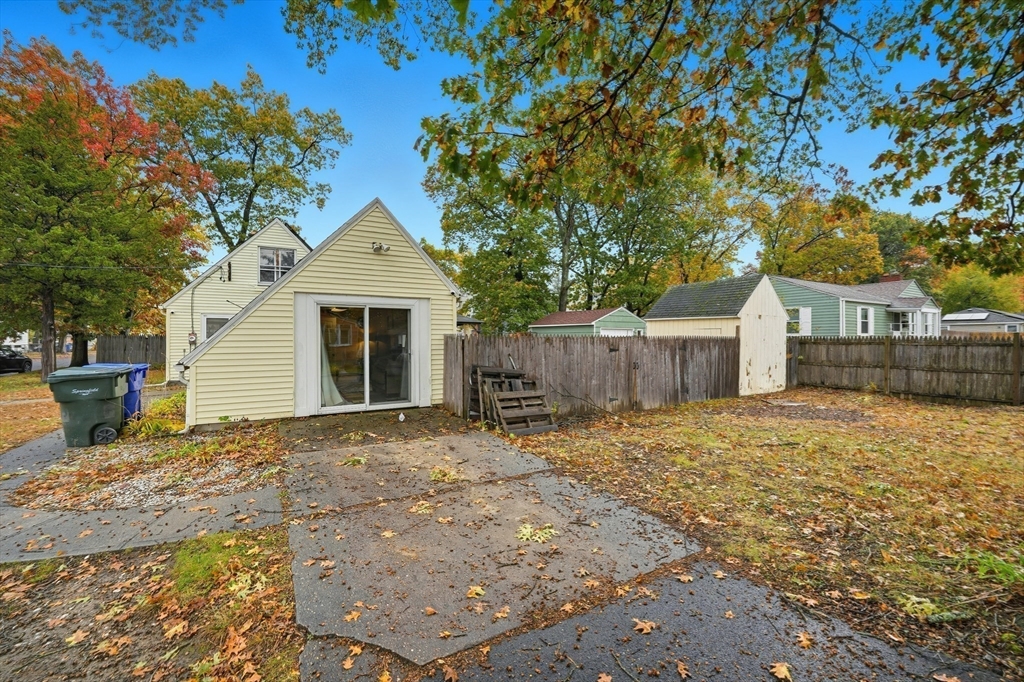 63 Peer Street Springfield, MA 01109 - Photo 6 of 41 a backyard of a house with table and chairs