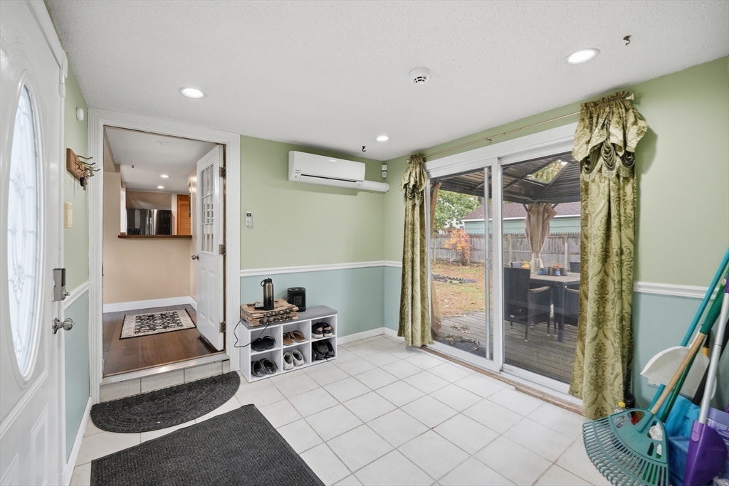 63 Peer Street Springfield, MA 01109 - Photo 7 of 41 a spacious bedroom with a bed and a glass door shower