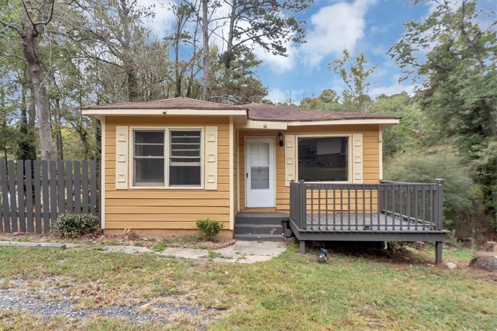 4161 Tell Road Southwest, Unit B Atlanta, GA 30331 - Photo 1 of 16 a view of a house with a yard and deck