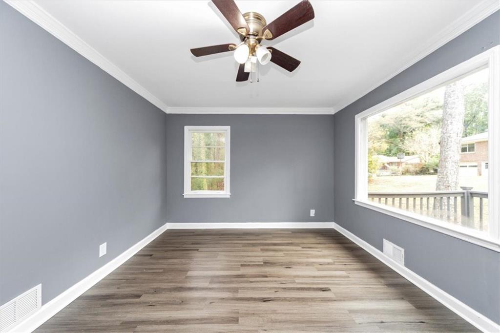 4161 Tell Road Southwest, Unit B Atlanta, GA 30331 - Photo 5 of 16 wooden floor in an empty room with a window