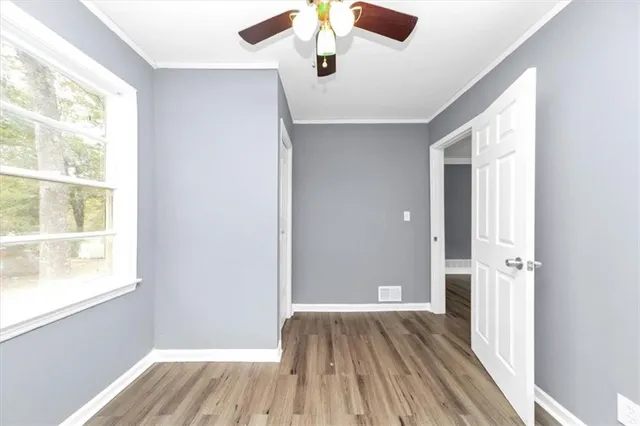 a view of a livingroom with wooden floor