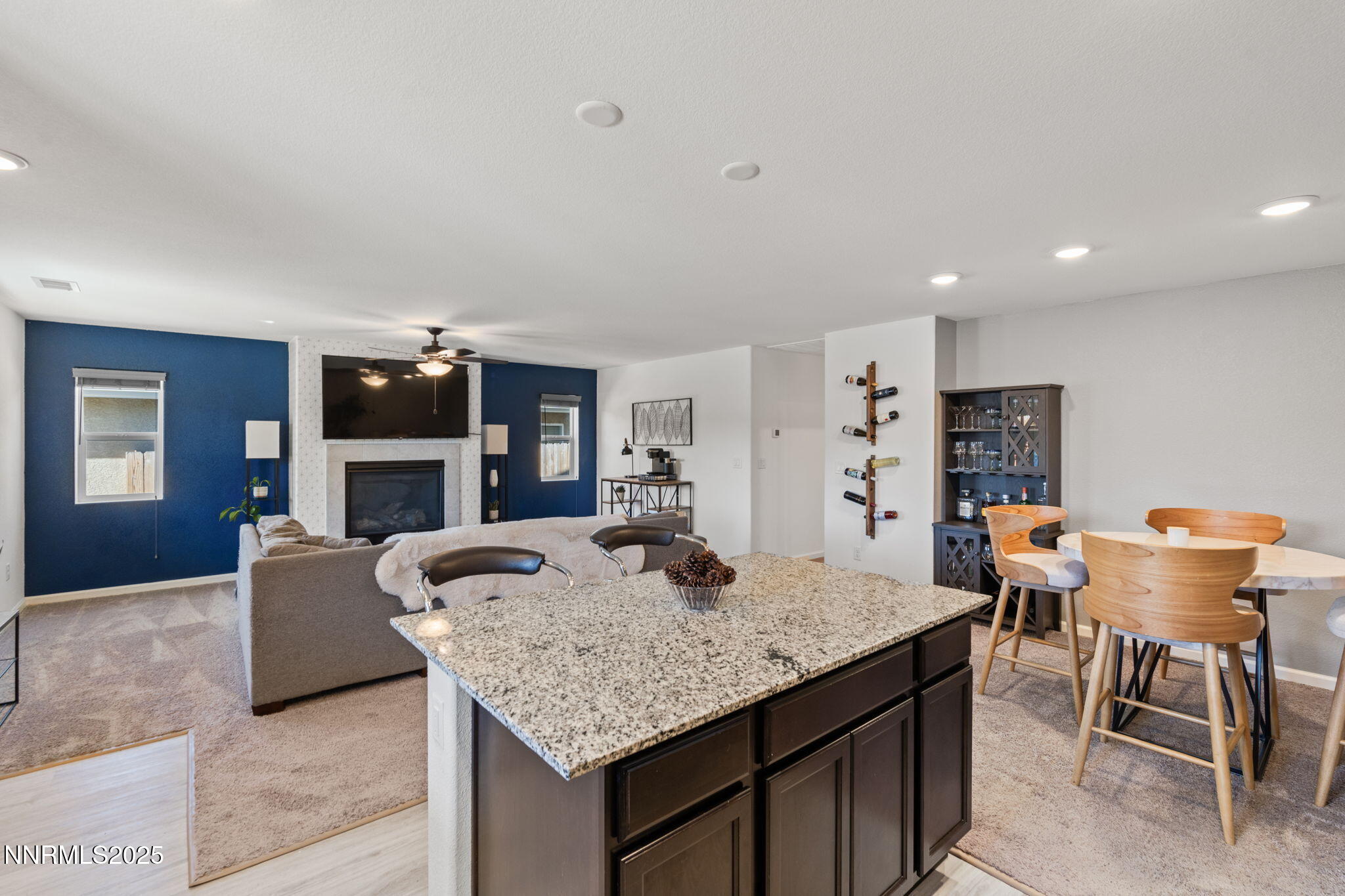 673 Mcgill Drive Reno, NV 89506 - Photo 11 of 34 a kitchen with granite countertop kitchen island stainless steel appliances sink dining table and chairs