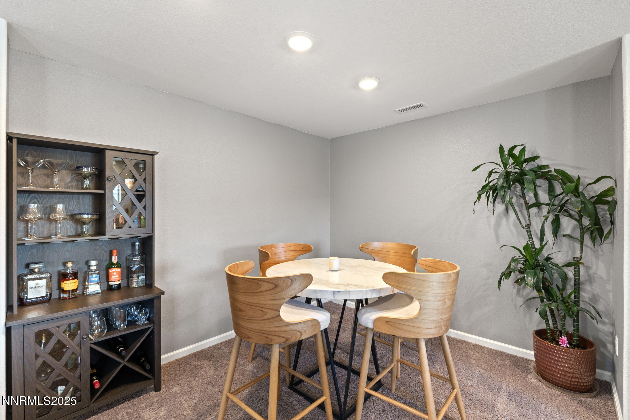 673 Mcgill Drive Reno, NV 89506 - Photo 14 of 34 a view of a dining room with furniture and potted plant