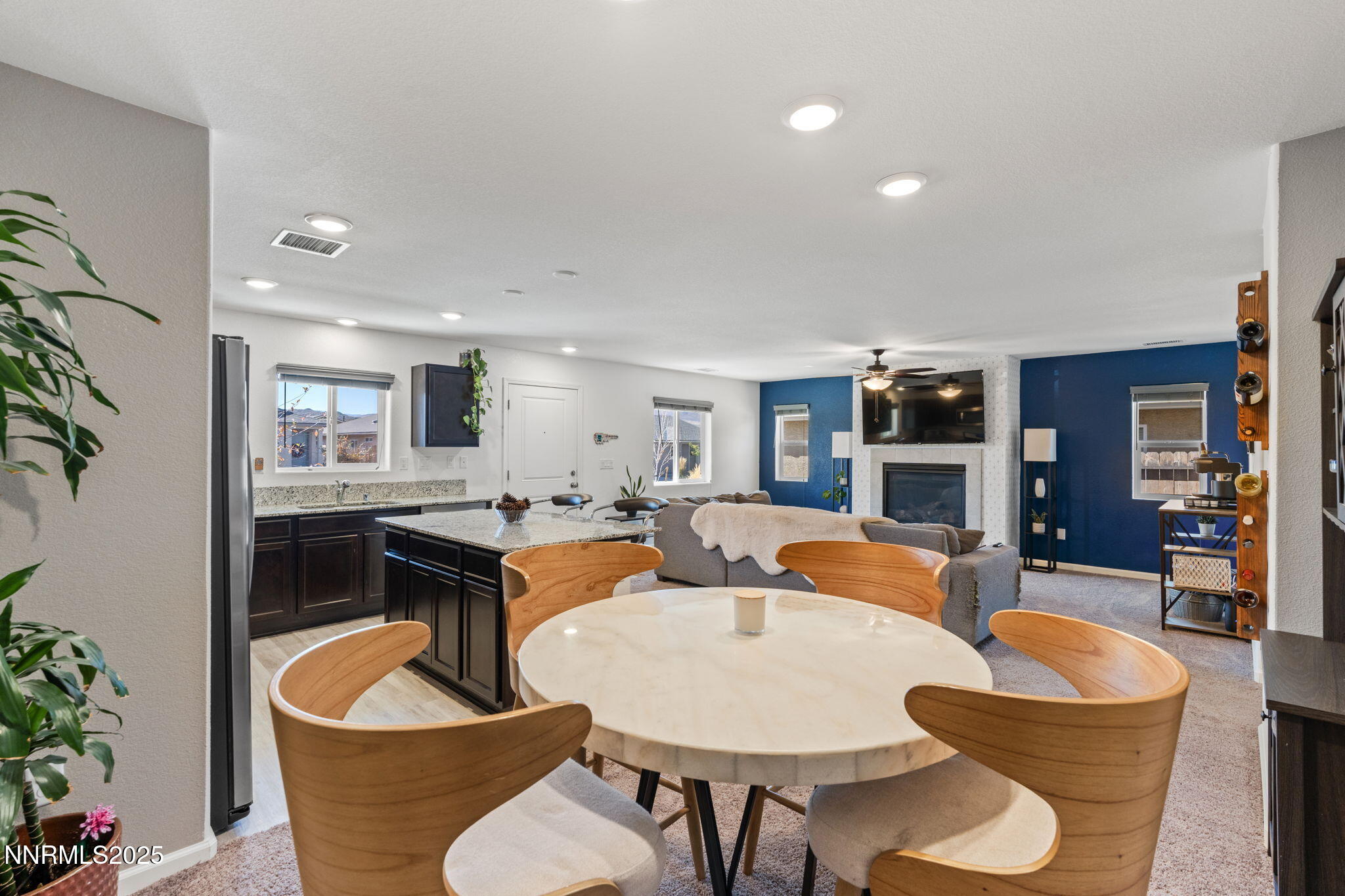 673 Mcgill Drive Reno, NV 89506 - Photo 16 of 34 a living room with furniture kitchen view and a potted plant