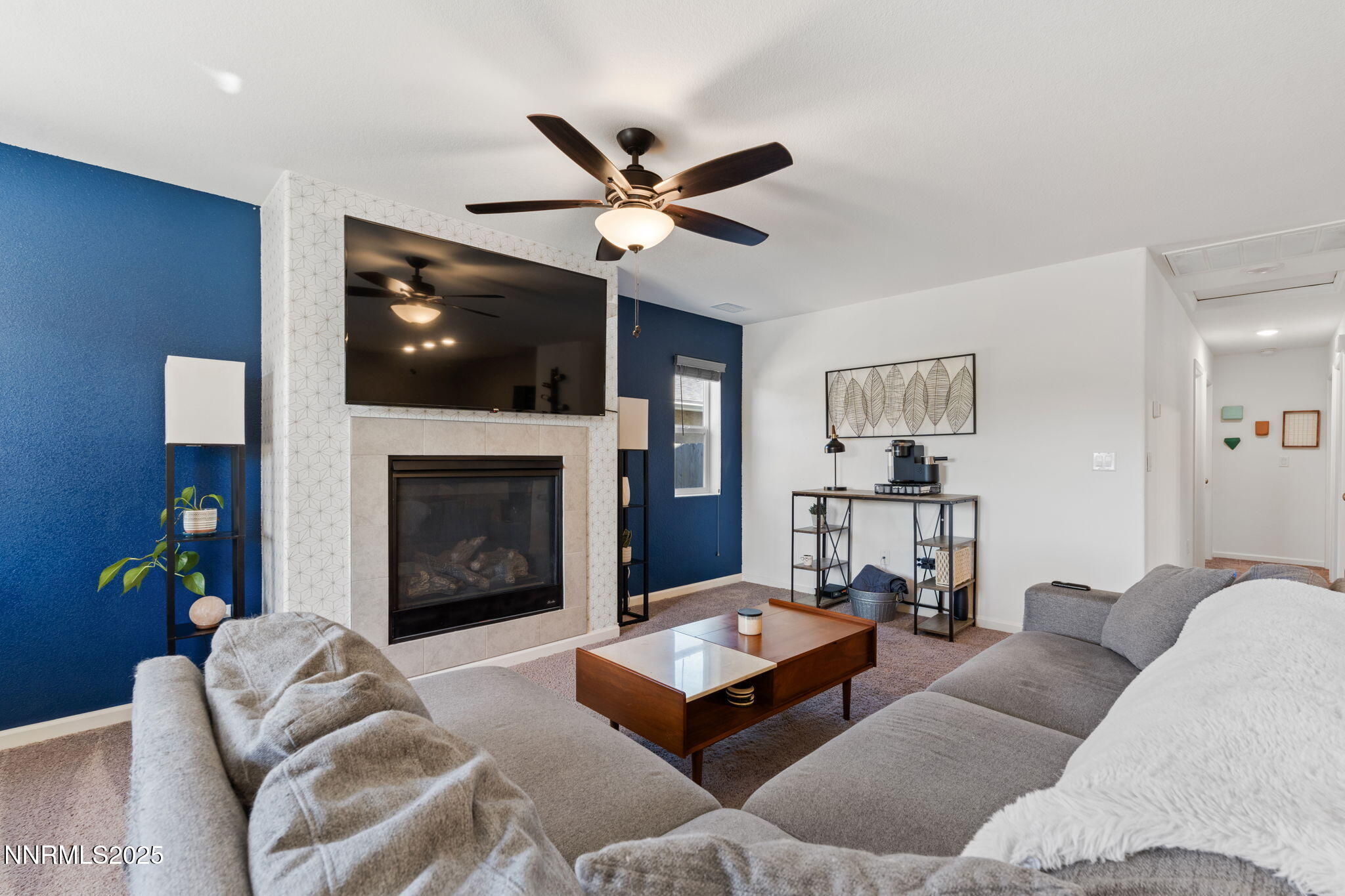 673 Mcgill Drive Reno, NV 89506 - Photo 18 of 34 a living room with furniture and a fireplace