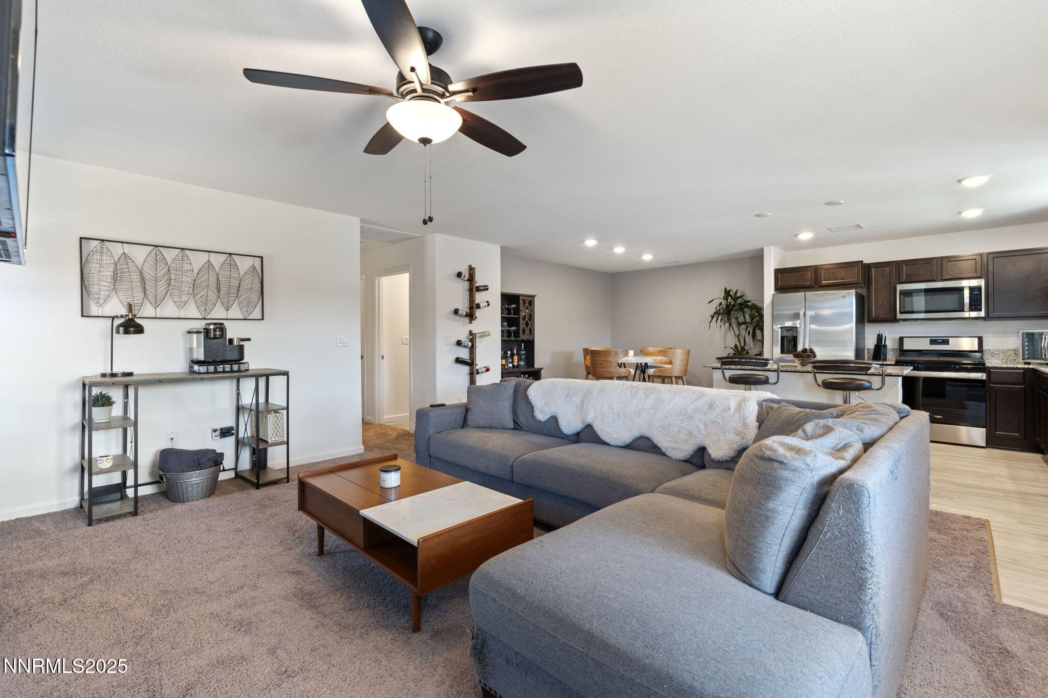 673 Mcgill Drive Reno, NV 89506 - Photo 20 of 34 a living room with furniture kitchen view and a chandelier