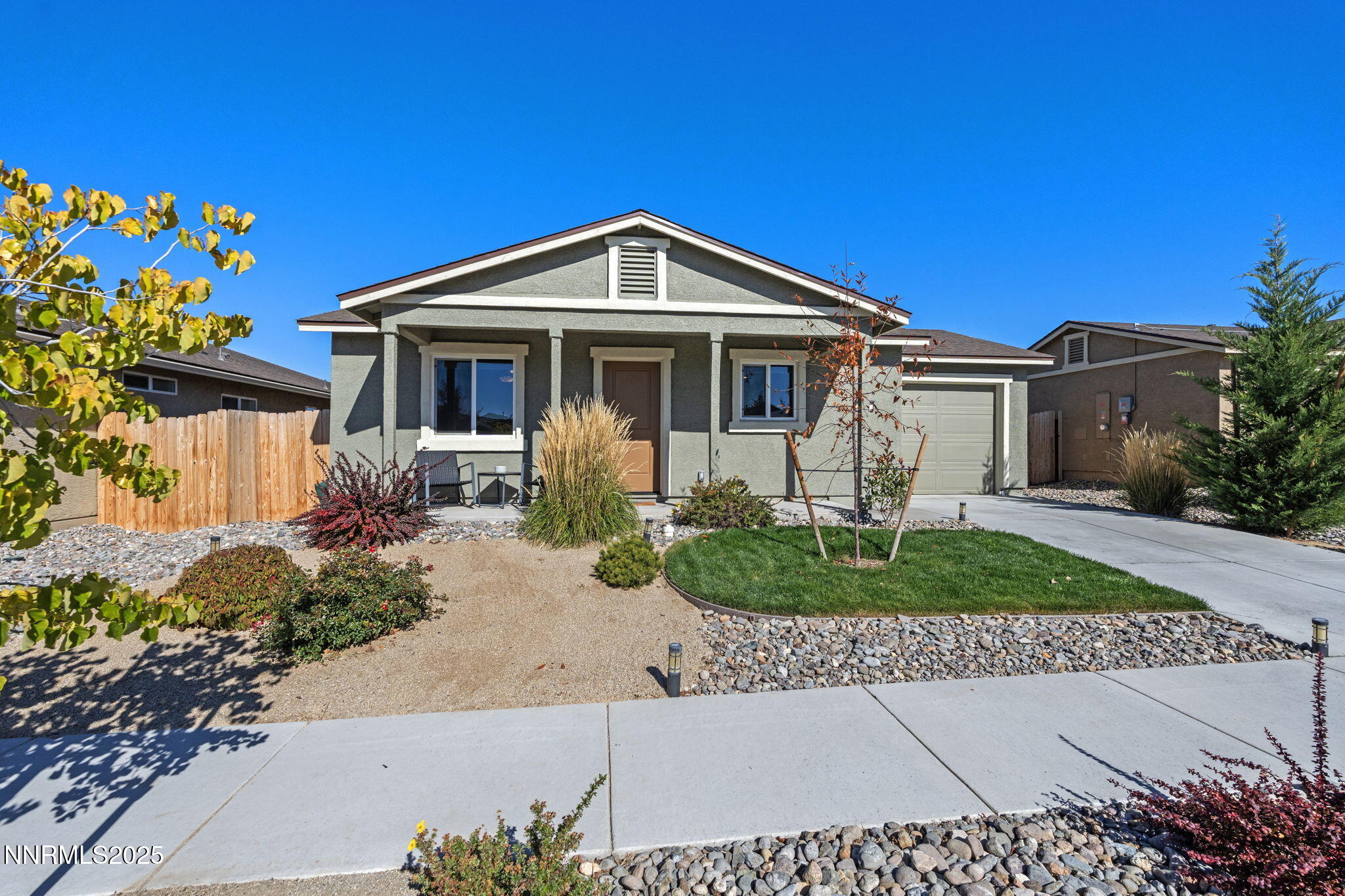 673 Mcgill Drive Reno, NV 89506 - Photo 2 of 34 a front view of a house with a yard