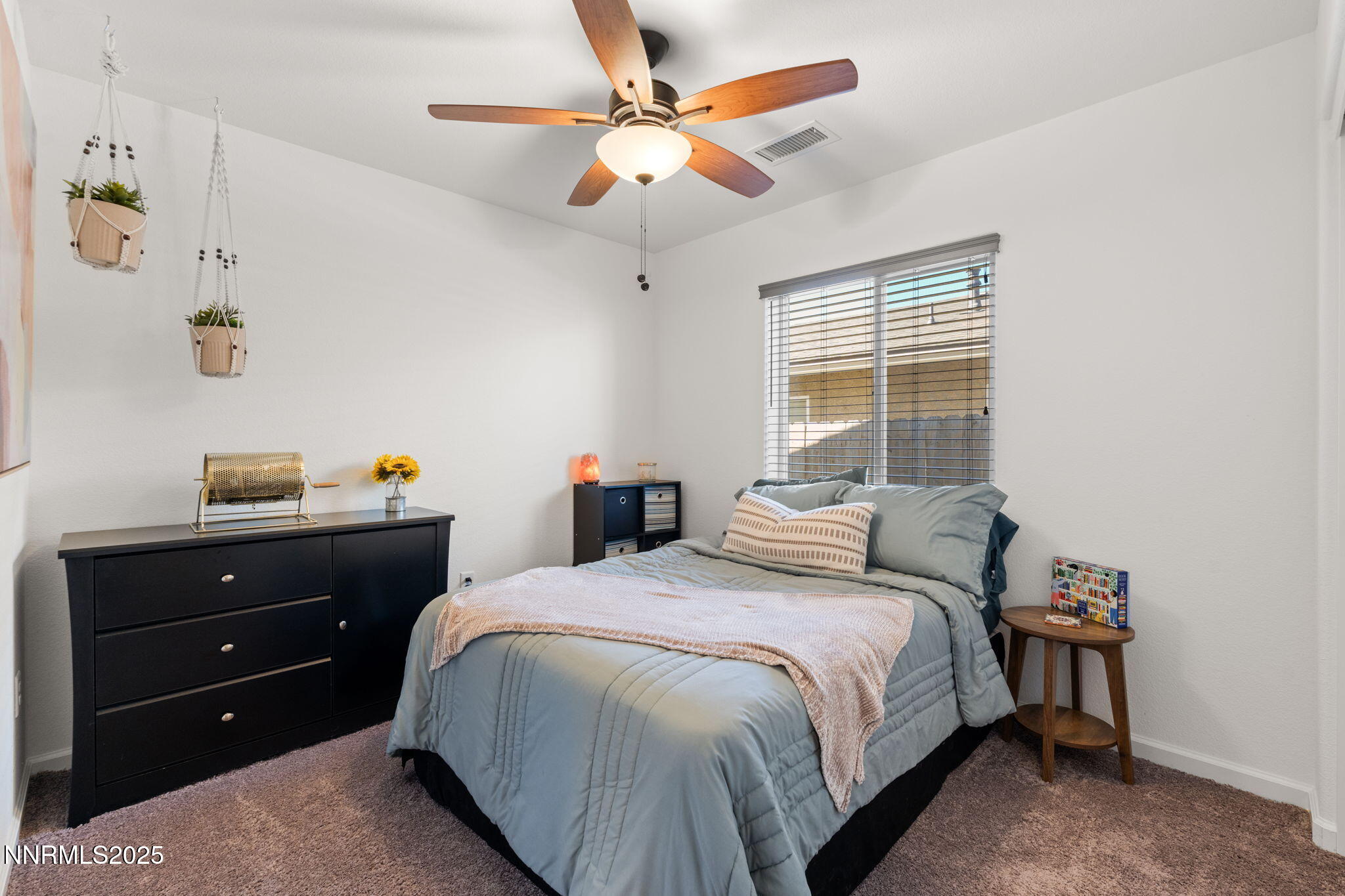 673 Mcgill Drive Reno, NV 89506 - Photo 26 of 34 a bedroom with a bed and a chandelier