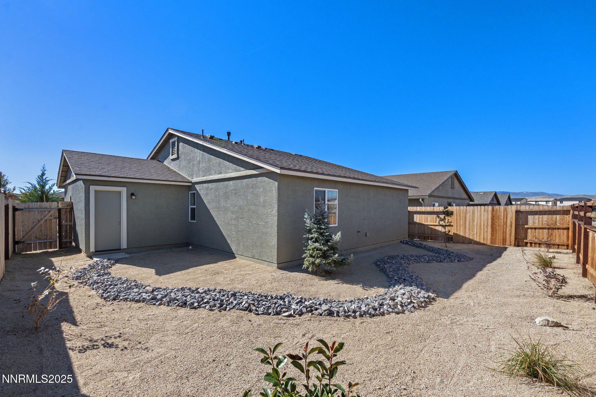 673 Mcgill Drive Reno, NV 89506 - Photo 29 of 34 a front view of a house with a yard