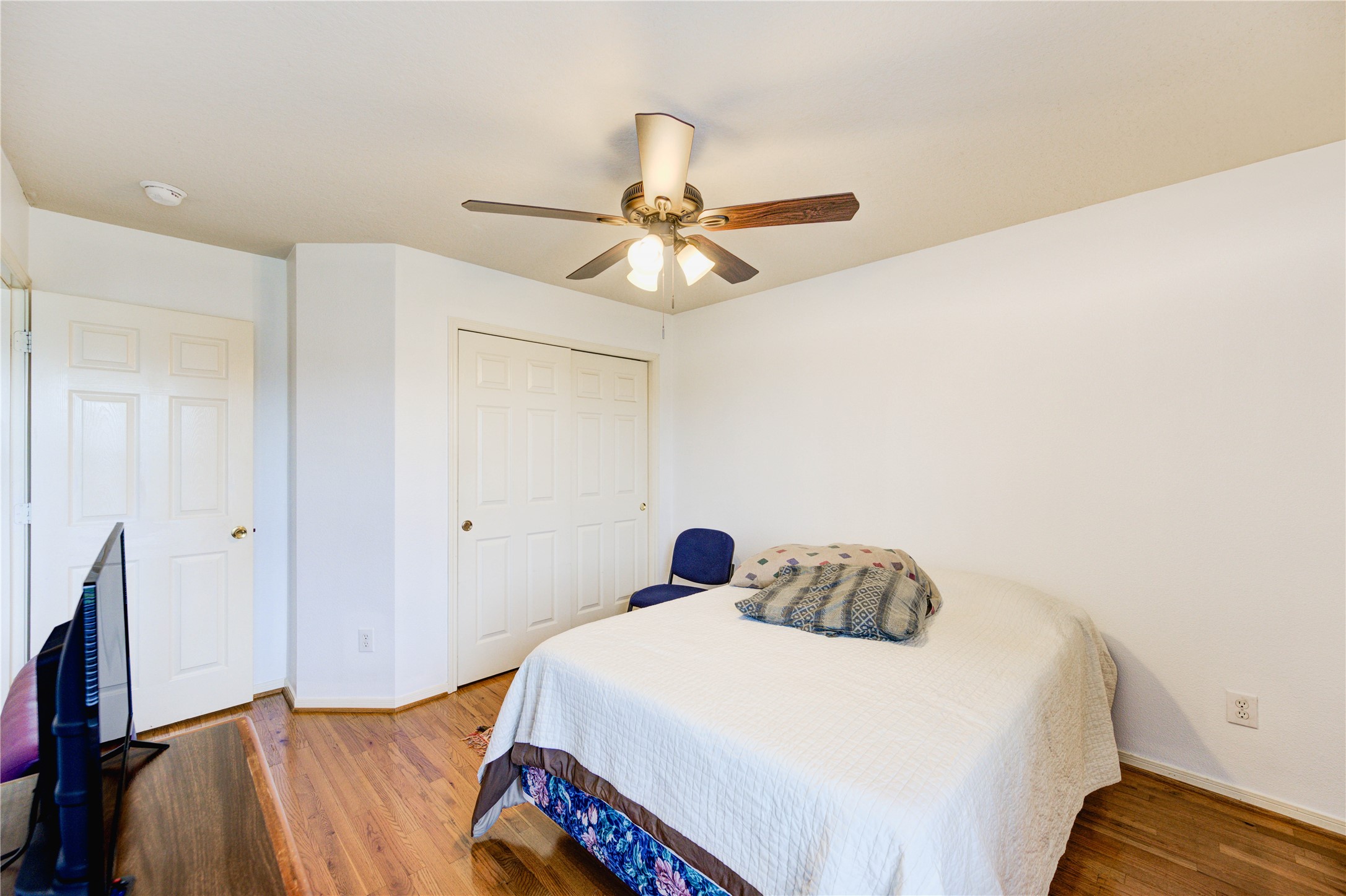 16730 Spring Barker Drive Cypress, TX 77429 - Photo 45 of 50 a bedroom with a bed and a chandelier