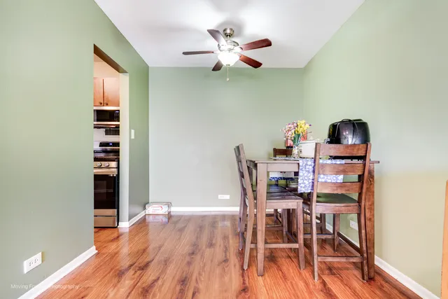 a kitchen with granite countertop wooden cabinets and a stove top oven