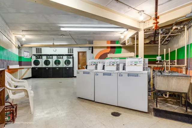 a view of parking garage with cars
