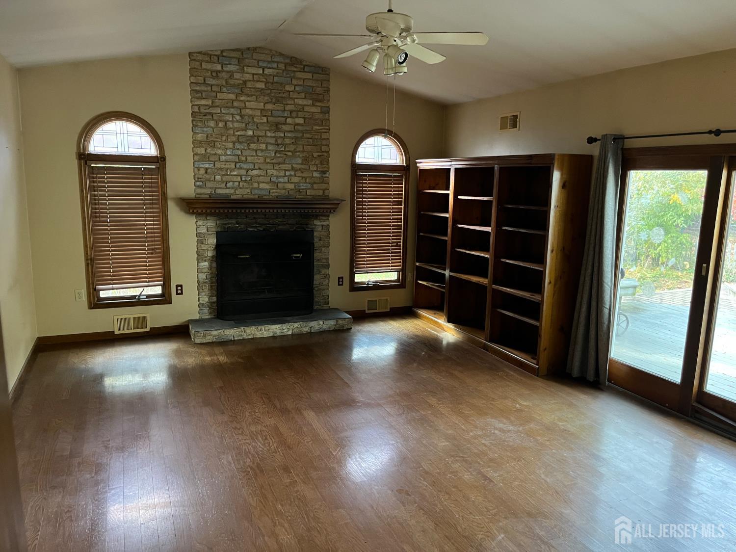 45 Old New Road Monmouth Junction, NJ 08852 - Photo 16 of 22 wooden floor in an empty room with a fireplace