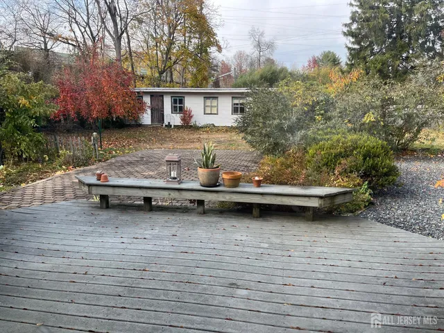 a backyard of a house with lots of green space and fountain